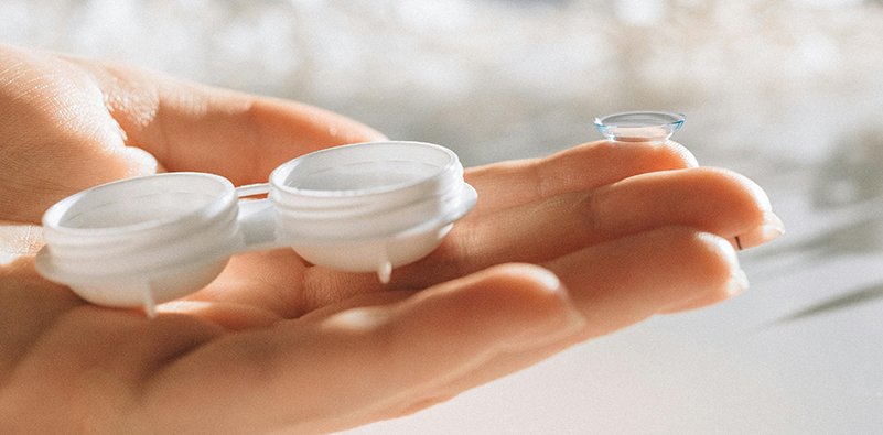 contact lenses on a hand