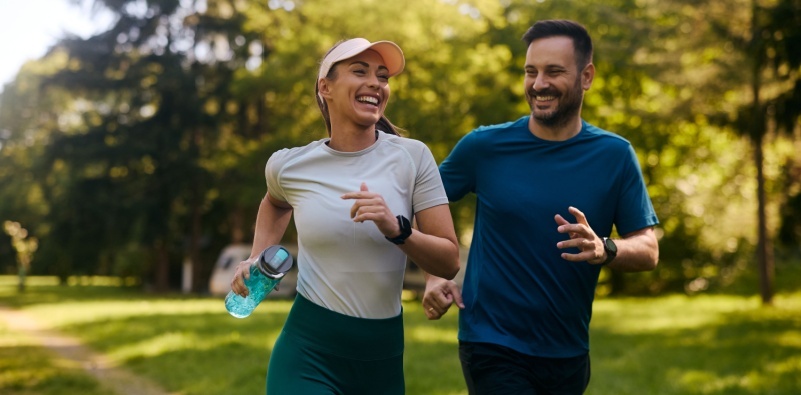men, women jogging together