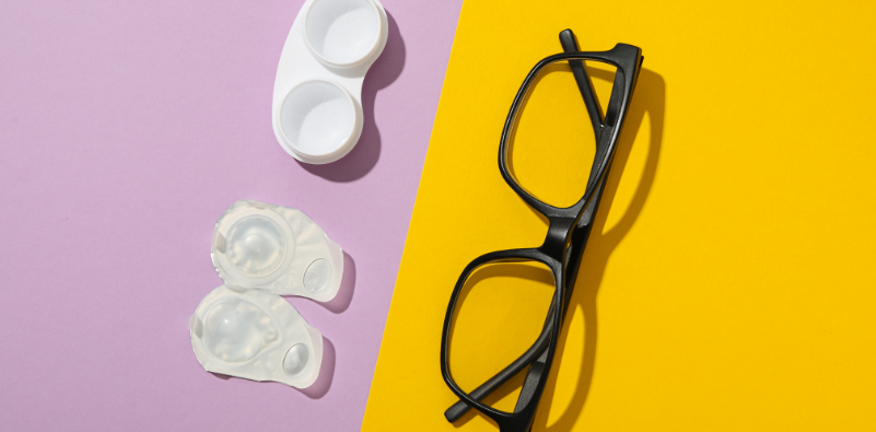 A pair of glasses, contact lenses and a contact lens case