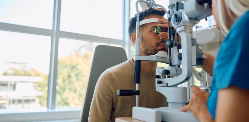 A man having an eye exam at the opticians
