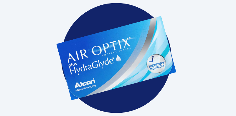 A graphic with a grey background, a navy circle in the centre of the image and a packshot of Air Optix monthly contact lenses.