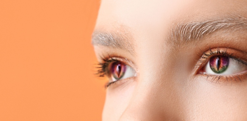 A close-up of a young person wearing cosmetic contact lenses for a Halloween party.